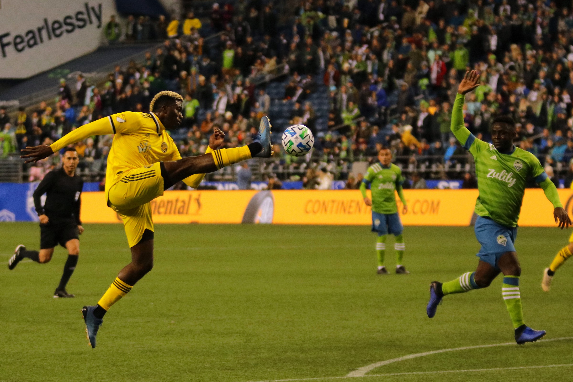 Crew Forward Gyasi Zardes (11) attempts to get past the Sounders