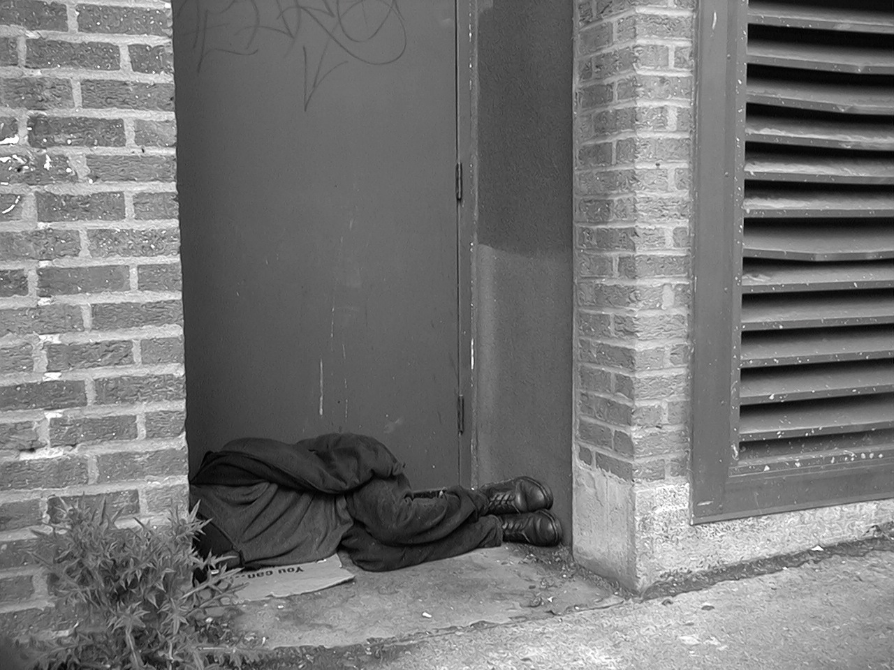 homeless man in alley