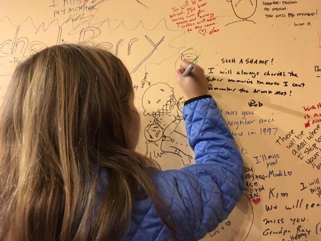 Children were among those who left messages on the wall at Walter's Cafe.