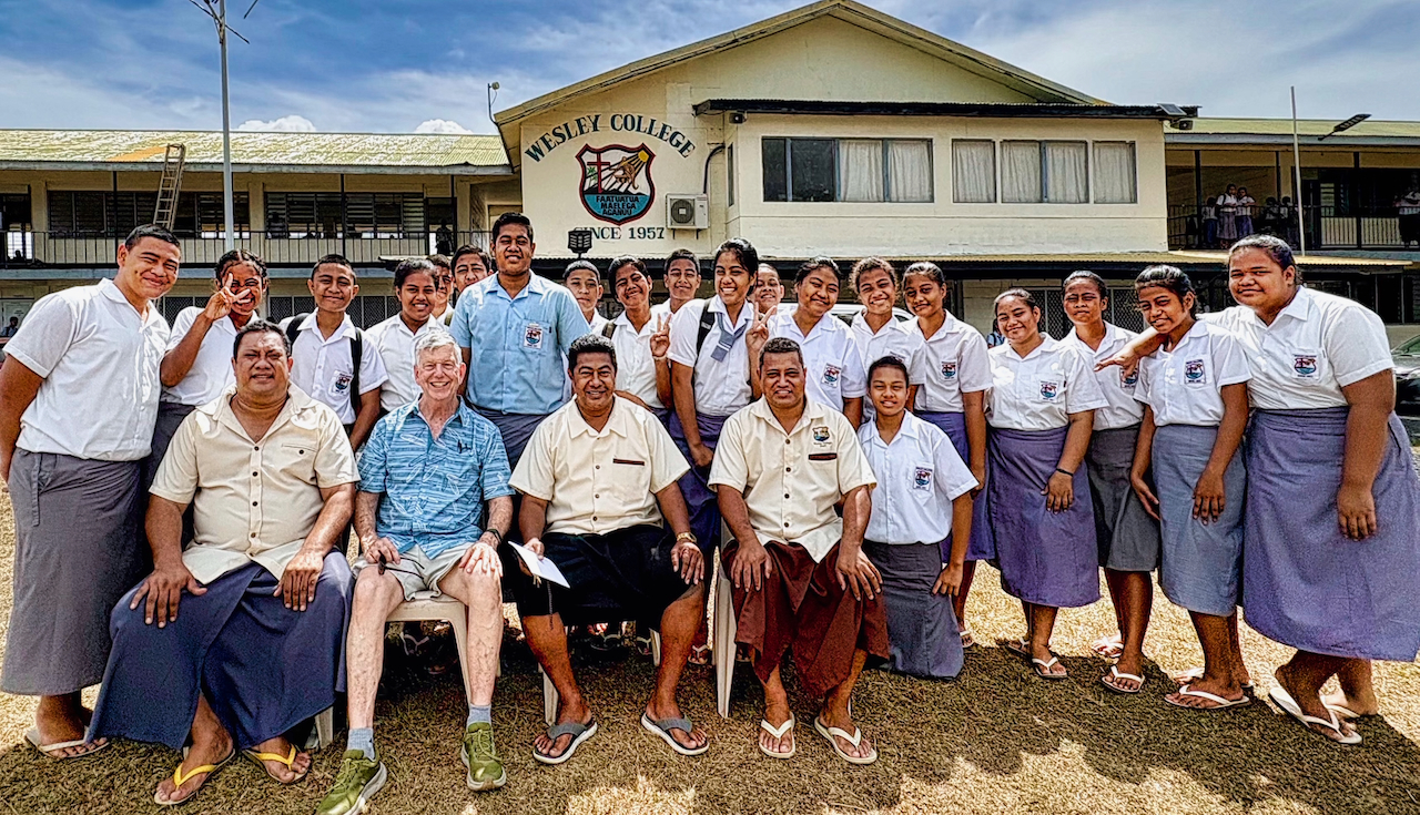 Conrad with students at Wesley College