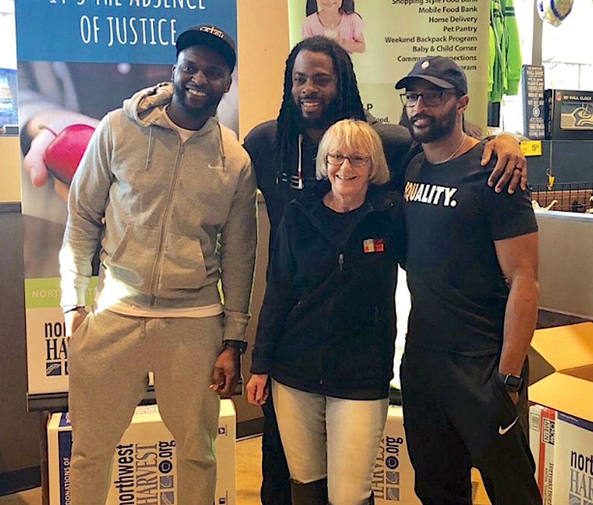 Judi is a big Seahawks fan - here with Cliff Avril, Richard Sherman & Doug Baldwin at the NW Harvest/Safeway food drive