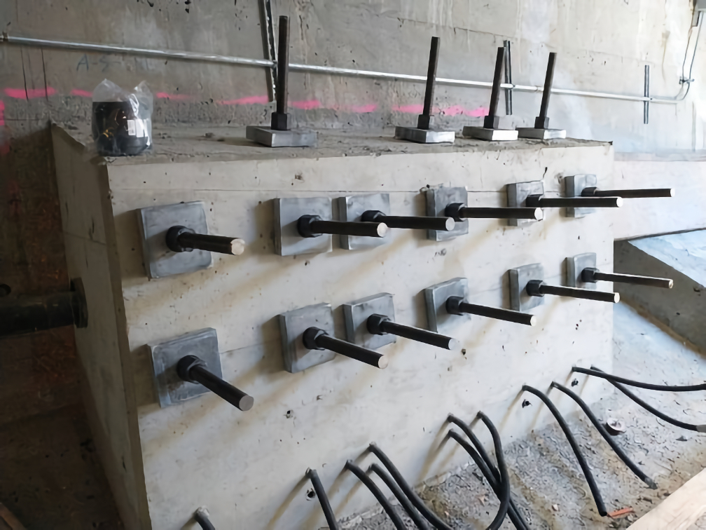 We inserted rods and tightened them into a concrete anchor block. This further strengthens the concrete and prepares it for the forces of the post-tensioning that will make the high bridge stronger.