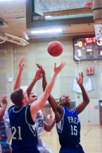 CS Sr. Greg Wilson (32) & SP So. Mitch Brewe (21) and SP Fr. Dj Fenner (15) fight for a rebound.jpg
