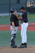 After giving up 3 runs in the 8th inning the Miner catcher has a talk with his pitcher.JPG