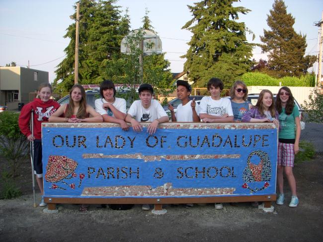 OLG Sign and Students.JPG.jpeg