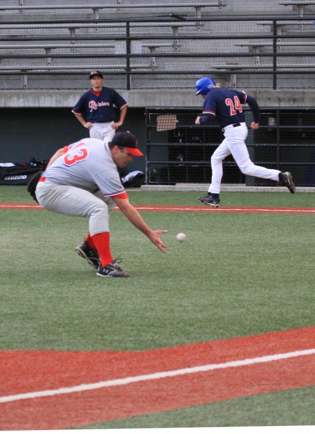 Islanders pitcher goes after bunt.JPG